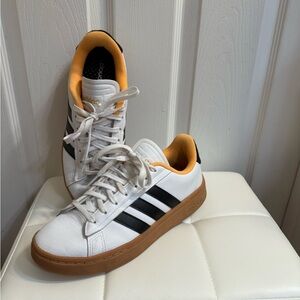 White and Black Sneakers with Orange Accents